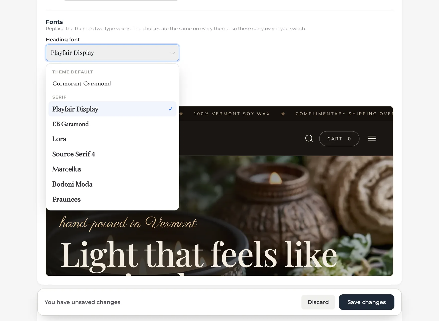 The Heading font list open on Brand & SEO, each name set in its own typeface: Cormorant Garamond marked Theme default, then the serif group with Playfair Display checked, and the live preview below showing the home page heading in Playfair Display.