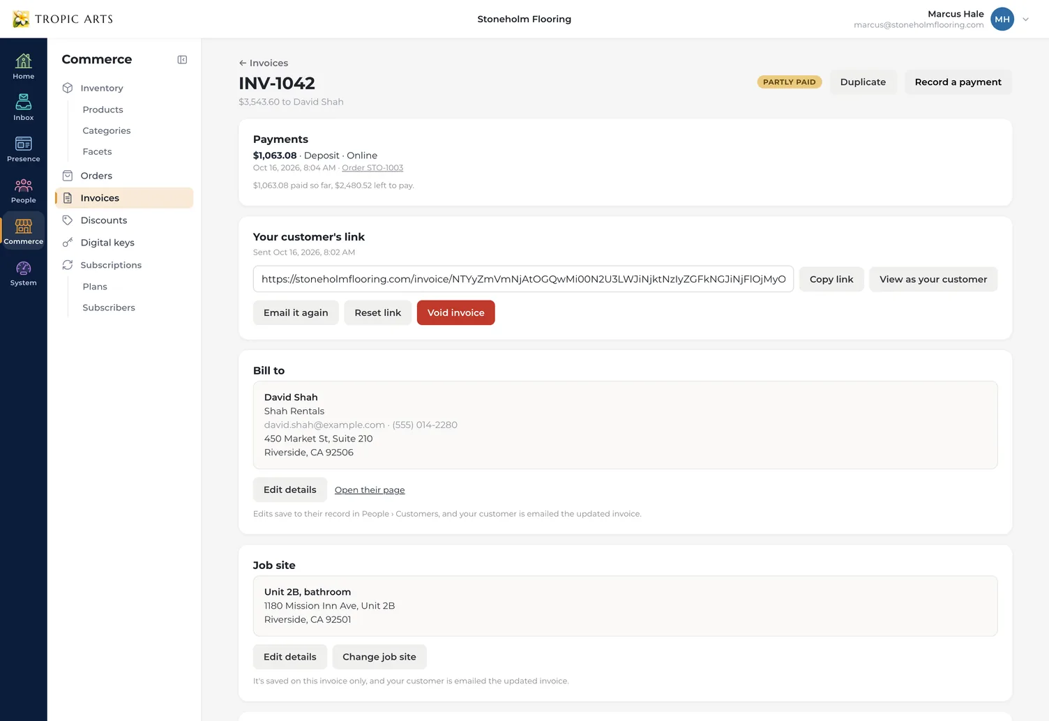 An invoice that's partly paid: a $1,063.08 deposit paid online on October 16, 2026 as order STO-1003, with $2,480.52 left to pay, above its customer link, the landlord it bills, and the rental unit as its job site.